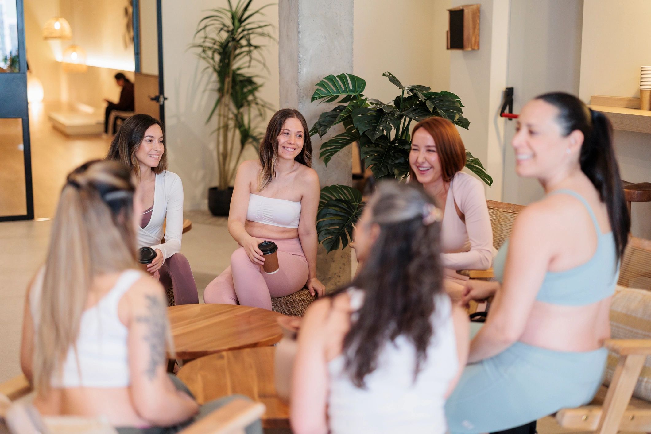 Team members chatting in a relaxed wellness setting